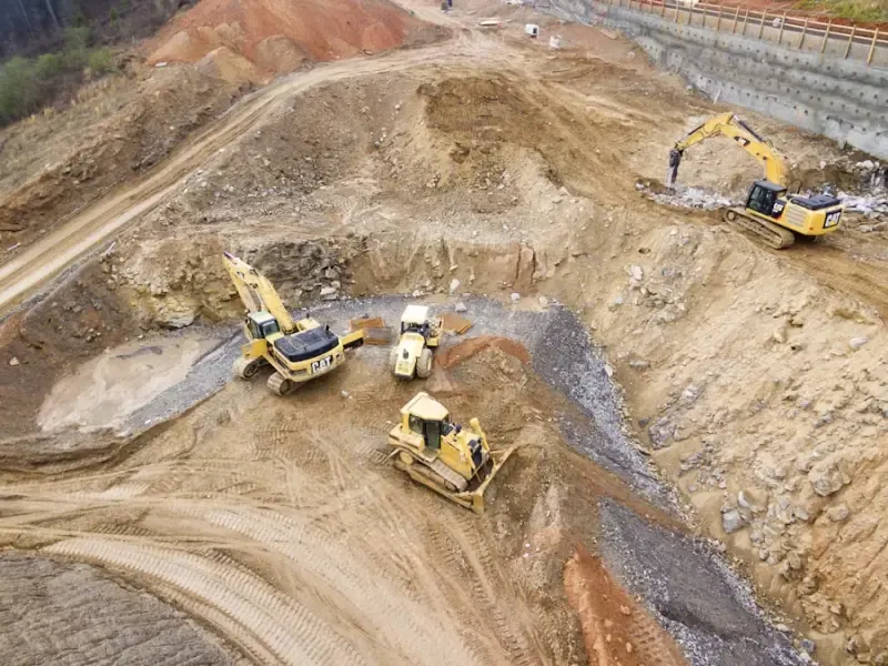 Heavy machinery preparing the foundation for a large infrastructure project